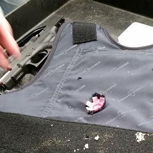 bullet proof vest with large  blank bullet in the chest area