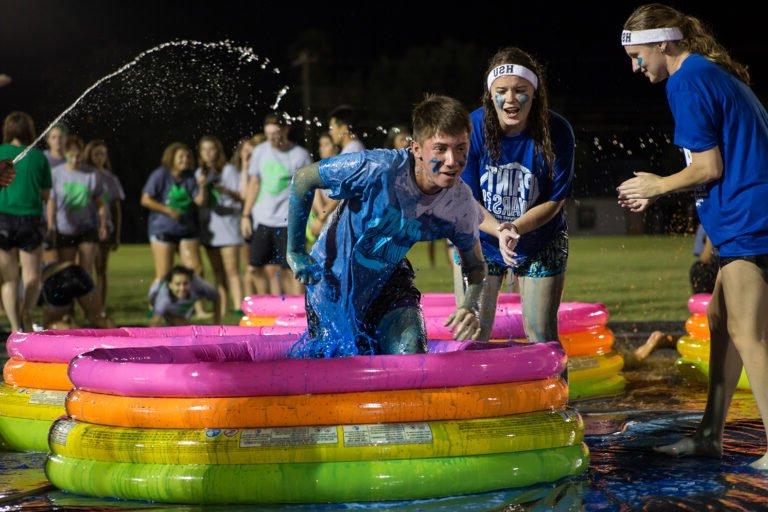 HSU students participate in an obstacle course involving paint